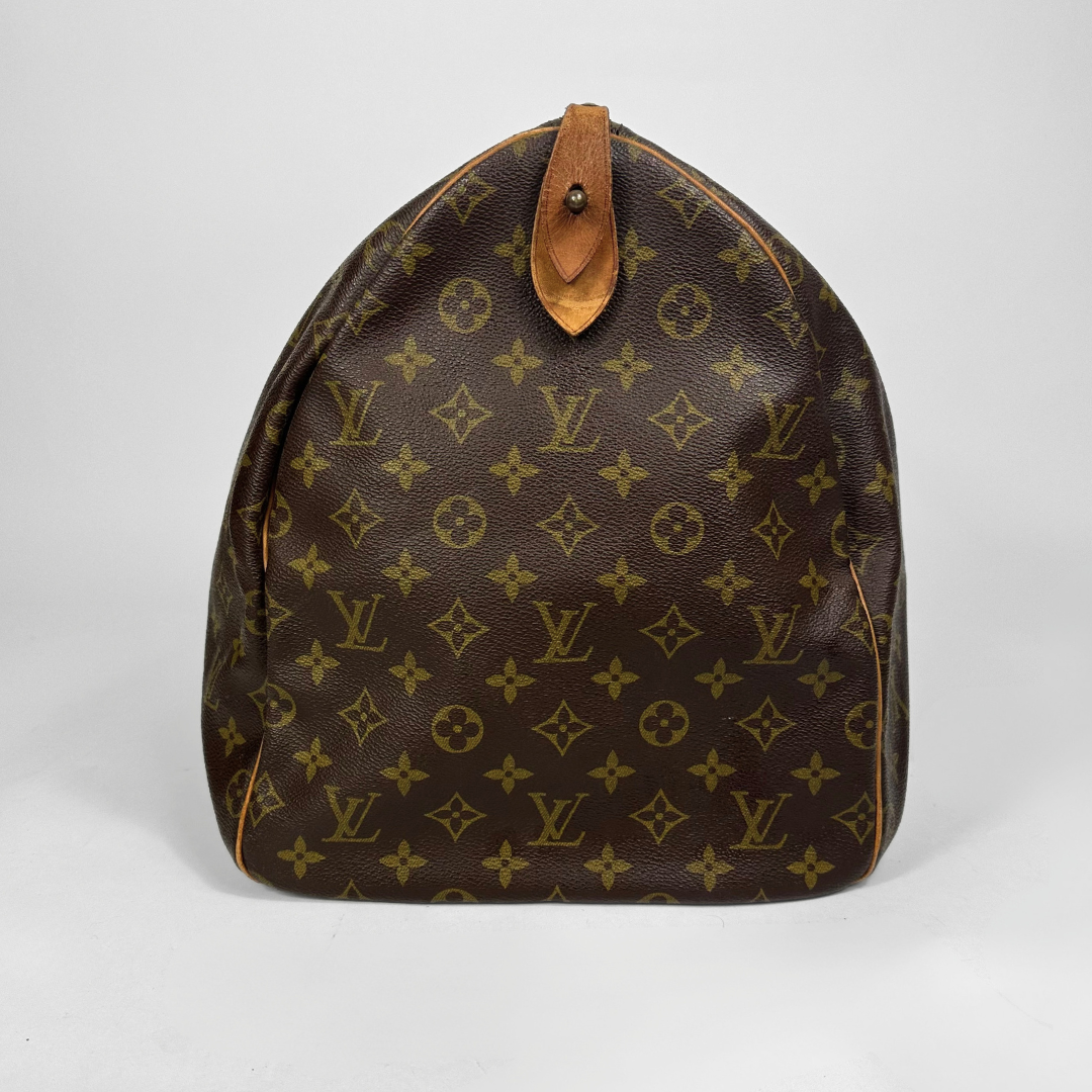 Brown Louis Vuitton bag with monogram pattern on a white background