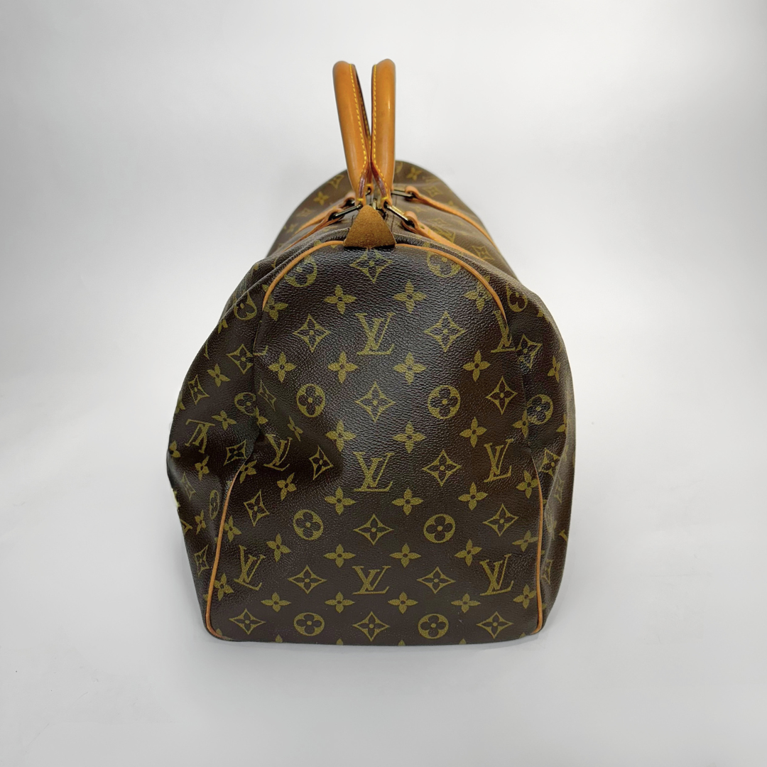 Louis Vuitton monogram bag on a light gray background