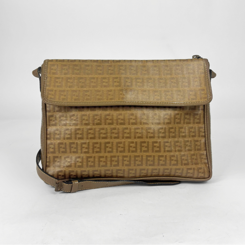 Brown textured handbag on a white background