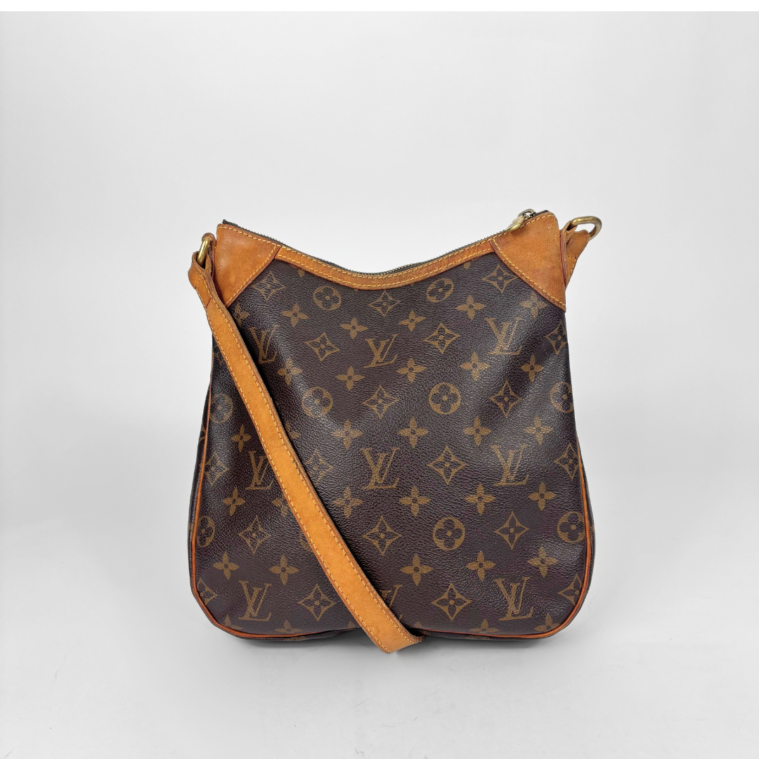 Designer handbag with monogram pattern on a white background