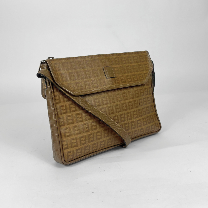 Brown textured handbag on a white background