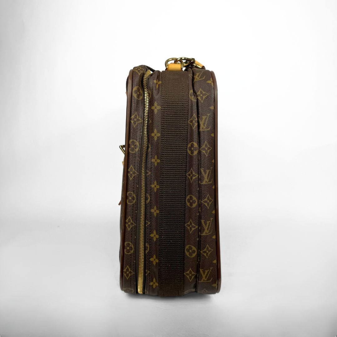 Brown leather bag with gold monogram pattern on a white background